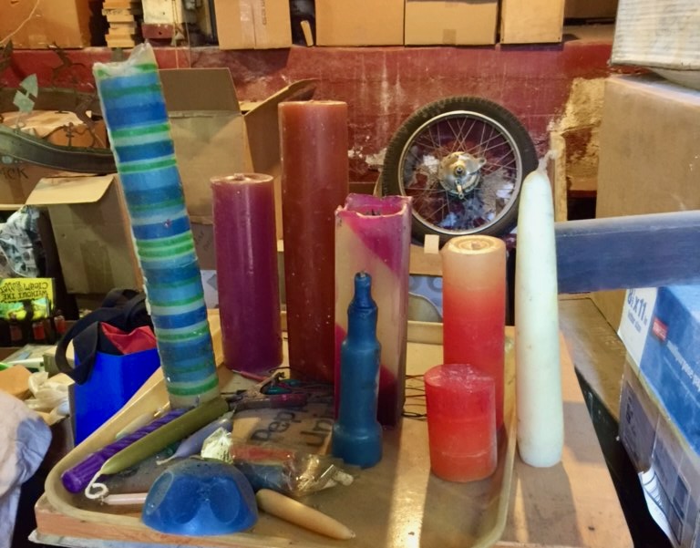 Photo of several pillar candles dating from the 1980s and 1990s.